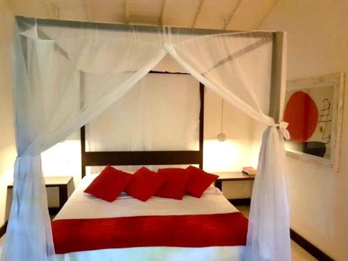 Ein Bett oder Betten in einem Zimmer der Unterkunft Mangueira Boutique Hotel Moreré
