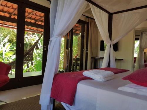 Ein Bett oder Betten in einem Zimmer der Unterkunft Mangueira Boutique Hotel Moreré
