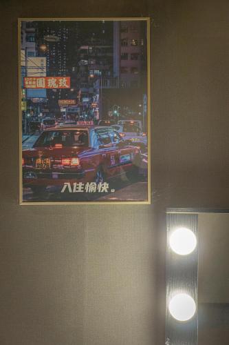 a poster of a race car on a wall at Shourin Hotel Cheonan by Aank in Cheonan
