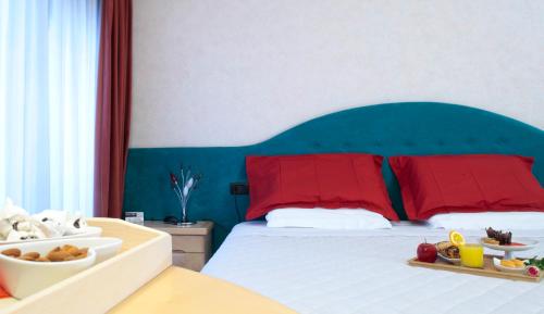 Ein Bett oder Betten in einem Zimmer der Unterkunft Hotel Contà Taste The Experience