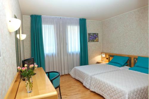 Ein Bett oder Betten in einem Zimmer der Unterkunft Hotel Contà Taste The Experience