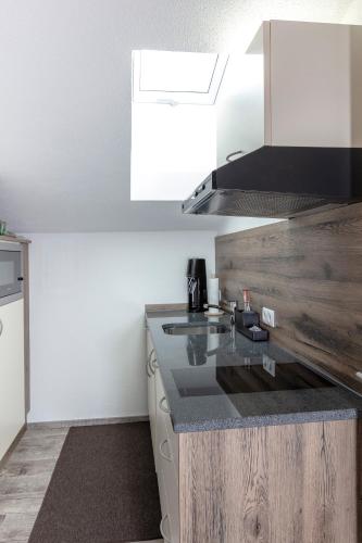 a kitchen with a sink and a counter top at Apart Felsenhof in Längenfeld
