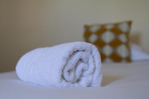a roll of toilet paper sitting on a table at Brit Hotel Europ Bergerac in Bergerac