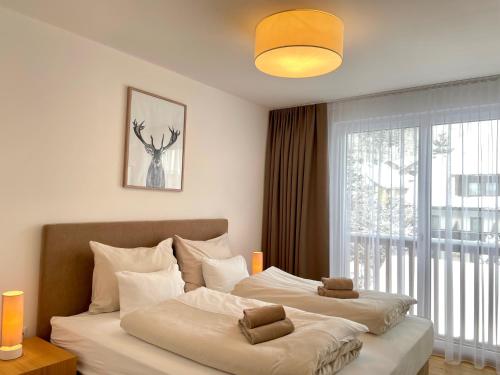 Posteľ alebo postele v izbe v ubytovaní die Tauplitz Lodges - Alm Lodge A8 by AA Holiday Homes