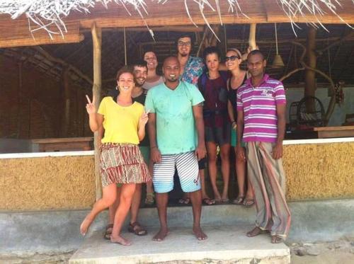 a group of people posing for a picture at The Alpha Monkey hotel & Tree house in Tangalle