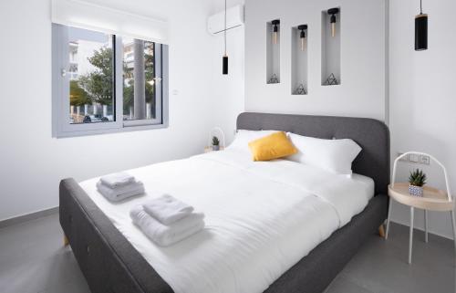 A bed or beds in a room at Andos Cozy & Luxury Upgraded Apartments