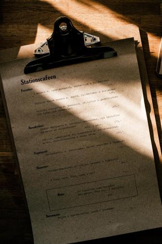 a piece of paper with a pen on top of it at Langebjerg Pension & Spisested in Allinge