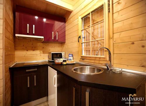 Η κουζίνα ή μικρή κουζίνα στο Cabañas Madarsu