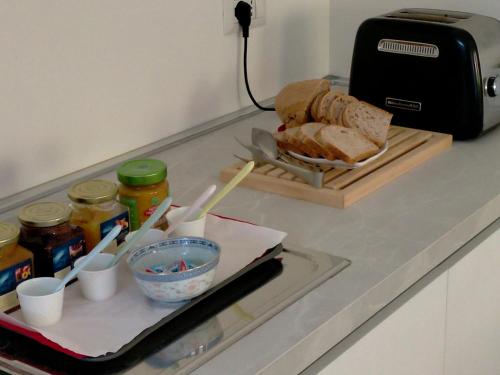a sandwich on a cutting board on a kitchen counter at B&B PREVISTO SOLE in Civitanova Marche