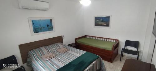Tempat tidur dalam kamar di Praia Palace
