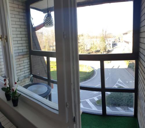 a window with a view of a street at Apartman Hana in Sanski most