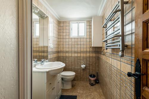 a bathroom with a sink and a toilet at Villa Nerja Views Mediterranean Panorama in Nerja