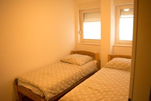 Un pat sau paturi într-o cameră la Apartman Bosa