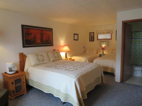 Katil atau katil-katil dalam bilik di The Pines Country Inn