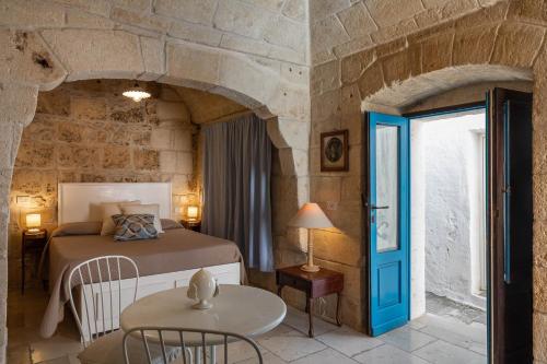 Postel nebo postele na pokoji v ubytování Albergo Diffuso Monopoli
