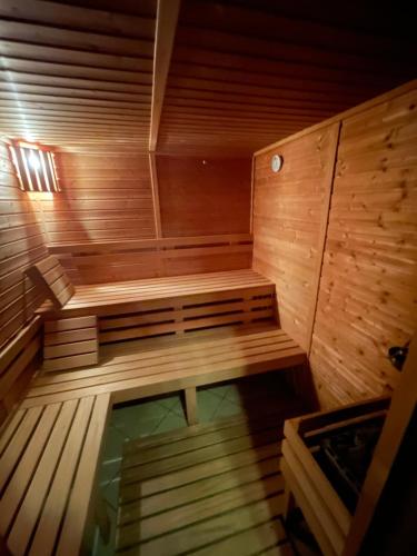 a wooden sauna with a bench in the middle at Ski apartmány Spiežovec Donovaly in Donovaly
