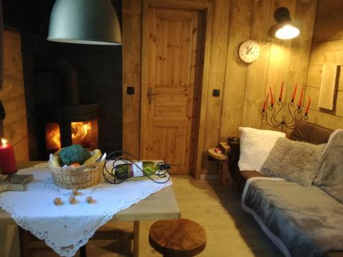 a living room with a couch and a fireplace at LES CHALET Kranjska Gora I in Kranjska Gora