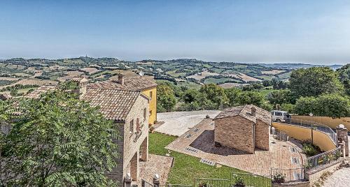 an aerial view of a building with a view of the hills at Il Ristoro Del Viandante in Offagna