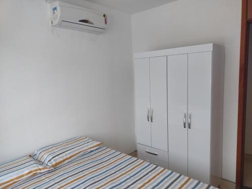 Ένα ή περισσότερα κρεβάτια σε δωμάτιο στο Apartamento na Praia dos Milionários em Ilhéus - Vog Atlântico