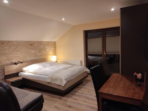 מיטה או מיטות בחדר ב-Willa Klaudia Ustroń Centrum