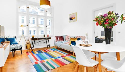 a living room with a table and a couch at Residence Dlouha - Old Town in Prague