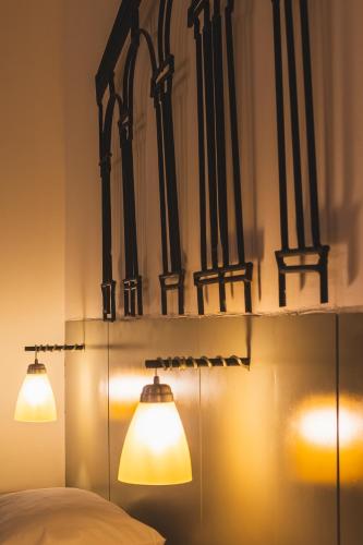 Ένα ή περισσότερα κρεβάτια σε δωμάτιο στο Rinconada Hotel Boutique