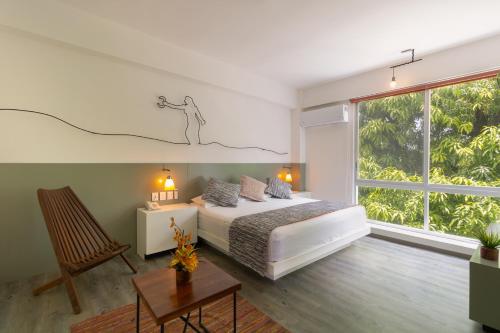 A bed or beds in a room at Rinconada Hotel Boutique