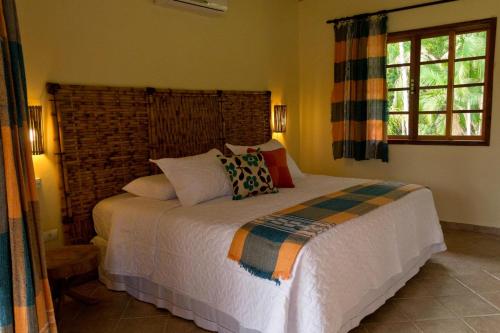 Säng eller sängar i ett rum på Casas Di Monte Ecopousada