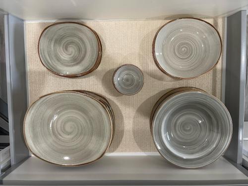 four plates in a drawer of a refrigerator at Luxury Ocean view Condo @ Aruba’s Palm Beach in Palm-Eagle Beach