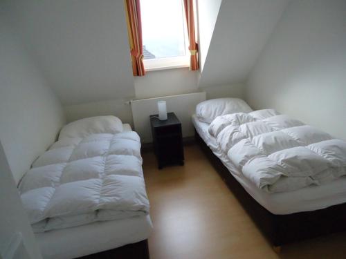 Een bed of bedden in een kamer bij Postwiese 21A
