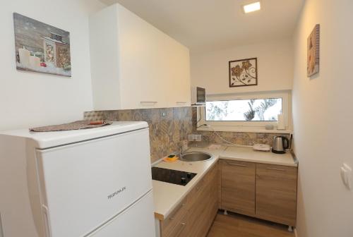 Η κουζίνα ή μικρή κουζίνα στο NEST Apartment