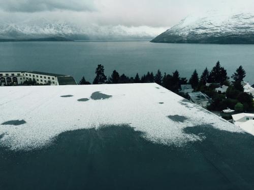 a view of the snow on the roof of a building at Queenstown Lake Panorama in Queenstown