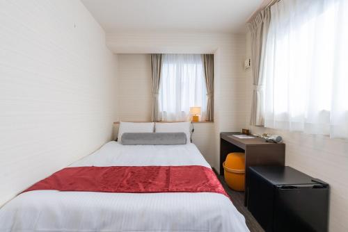 Postel nebo postele na pokoji v ubytování Kyoto inn Mio