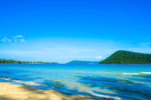 a view of the ocean with a island in the distance at Lazy Bones in Koh Rong Sanloem