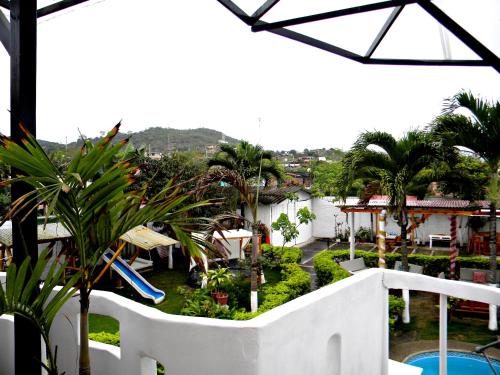 a view of the garden from the balcony of a hotel at Centro Vacacional "El Pro" in Puerto López