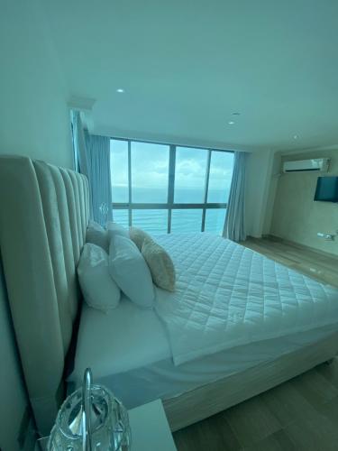 Postel nebo postele na pokoji v ubytování Malecón vista mar Habitación Privada Larimar,