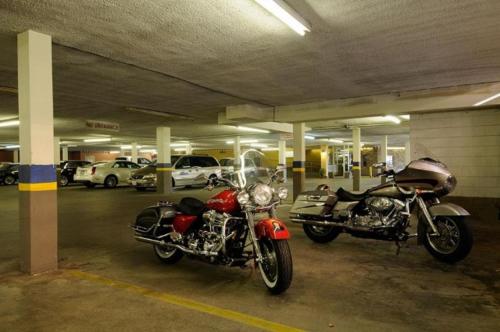 two motorcycles parked in a parking garage at Days Inn & Suites by Wyndham Sault Ste. Marie ON in Sault Ste. Marie
