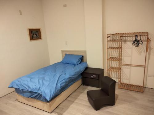 Postel nebo postele na pokoji v ubytování Yataku 雅德背包客舍