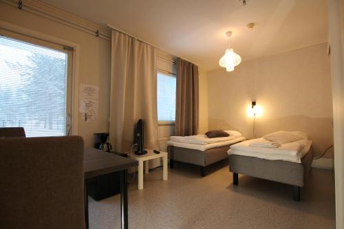 Ένα ή περισσότερα κρεβάτια σε δωμάτιο στο Teemahostel