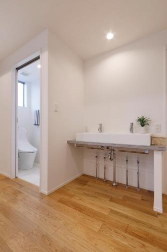 a bathroom with a sink and a toilet at SEASIDE TERRACE SUN in Enoura