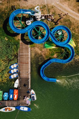 an aerial view of a water park with a water slide at Ośrodek Wypoczynkowy Kalwa in Pasym