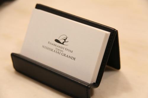 a book in a black case on a table at Rembrandt Style Tokyo Nishikasai Grande in Tokyo