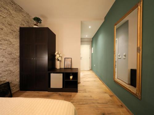 Кровать или кровати в номере Aldo Apartments Center
