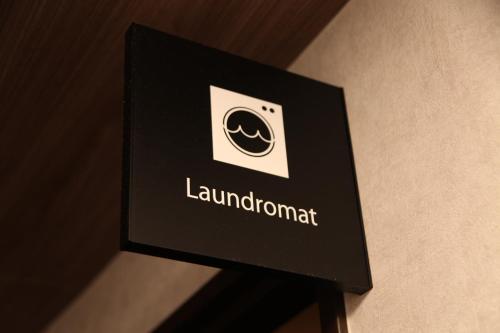 a sign for a lamborghini dealership on a wall at Rembrandt Style Tokyo Nishikasai Grande in Tokyo