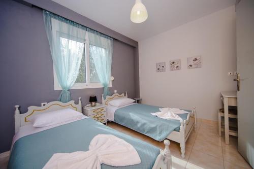 Ένα ή περισσότερα κρεβάτια σε δωμάτιο στο Sunset Apartments