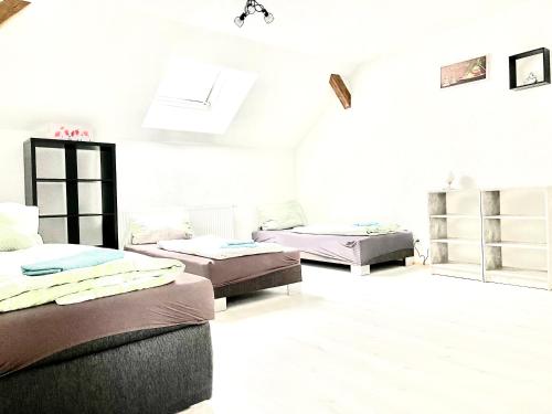 Un ou plusieurs lits dans un hébergement de l'établissement #WORLD Monteur Apartment