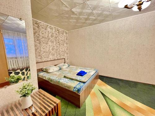 Llit o llits en una habitació de Apartment TwoPillows on Parkovaya 40a