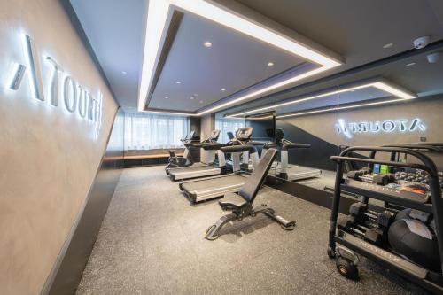 a gym with a row of exercise bikes in a room at Atour Hotel Quzhou Nankong in Quzhou