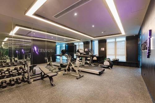 a gym with treadmills and machines in a room at Atour Hotel Nanjing Xianlin Center Jinying Plaza in Nanjing