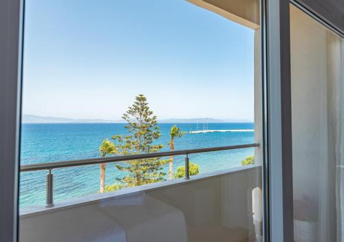 a view of the ocean from a bathroom window at Orpheus Studios in Kos Town